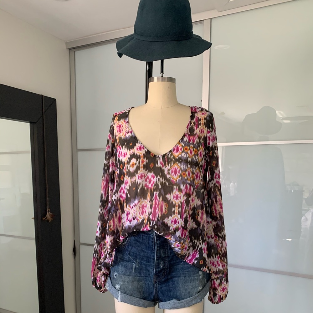 show me your Mumu Asymmetrical bishop sleeves top.